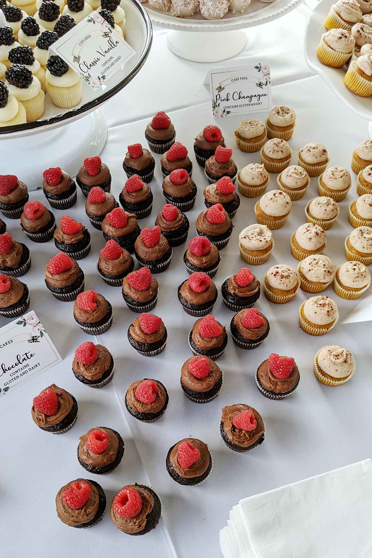 raspberry cupcakes on table