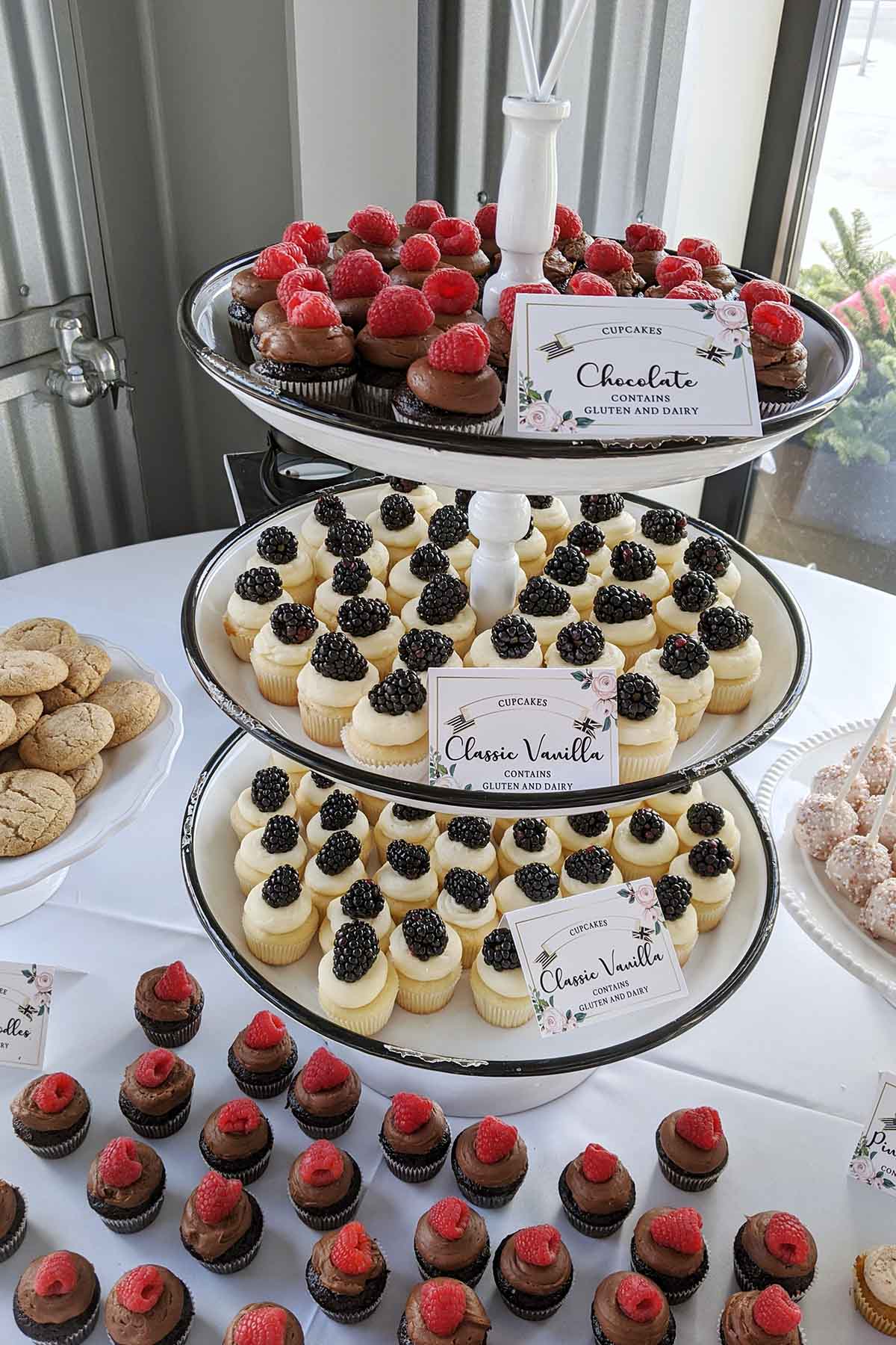 blackberry cupcakes on cake tier