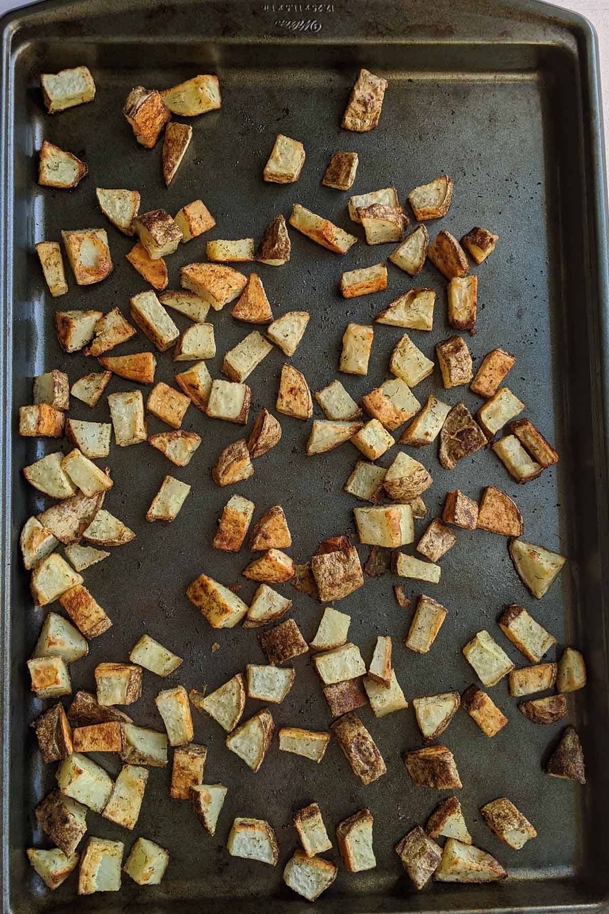 roasted russet potatoes on a sheet pan.