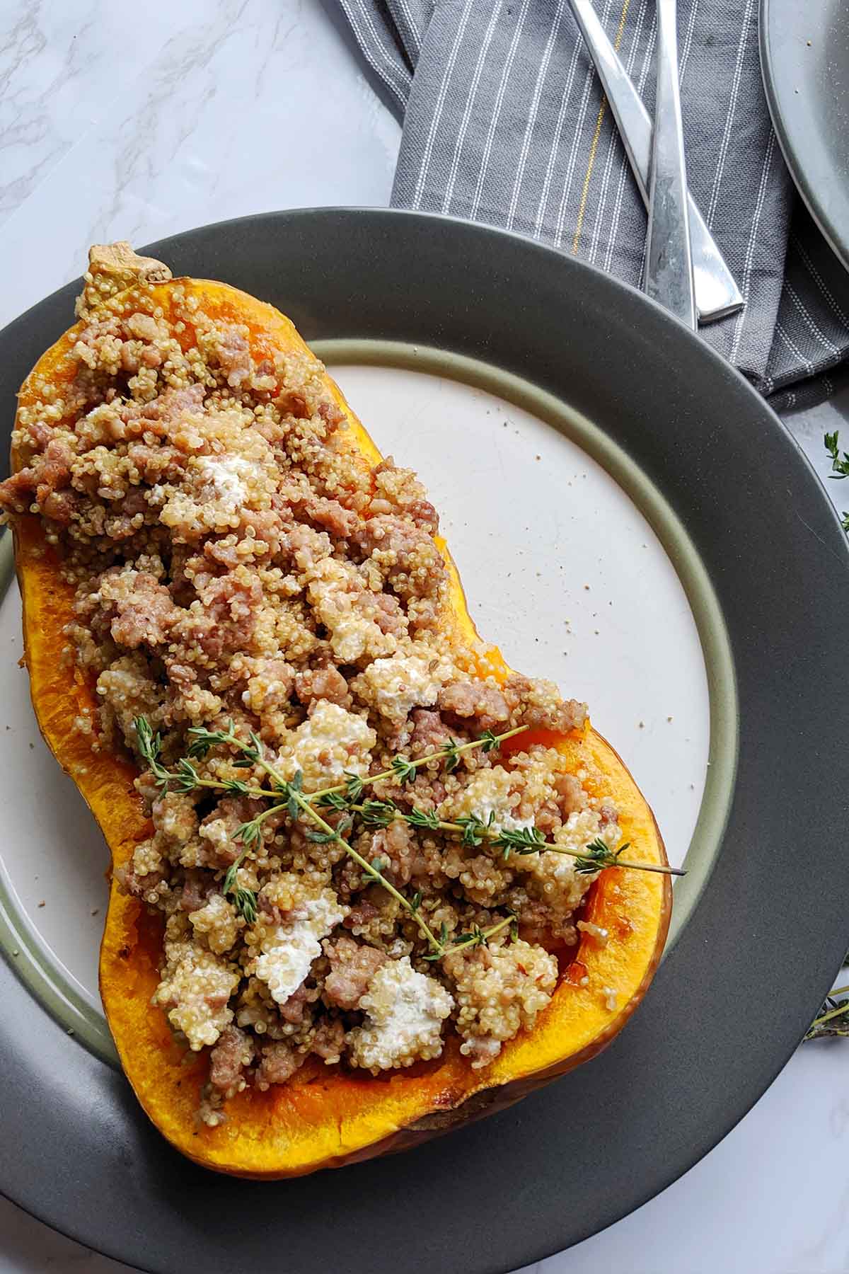 stuffed butternut squash on a dinner plate.