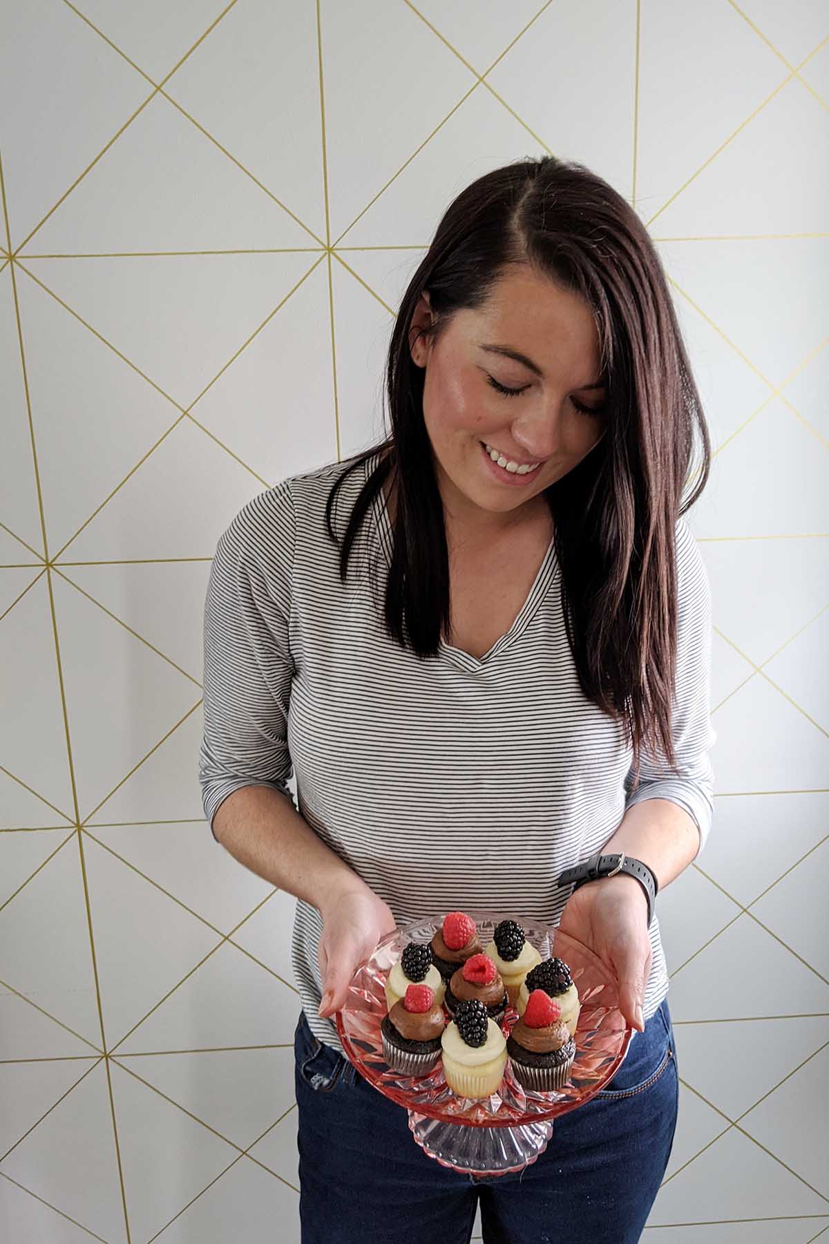 person holding cupcakes