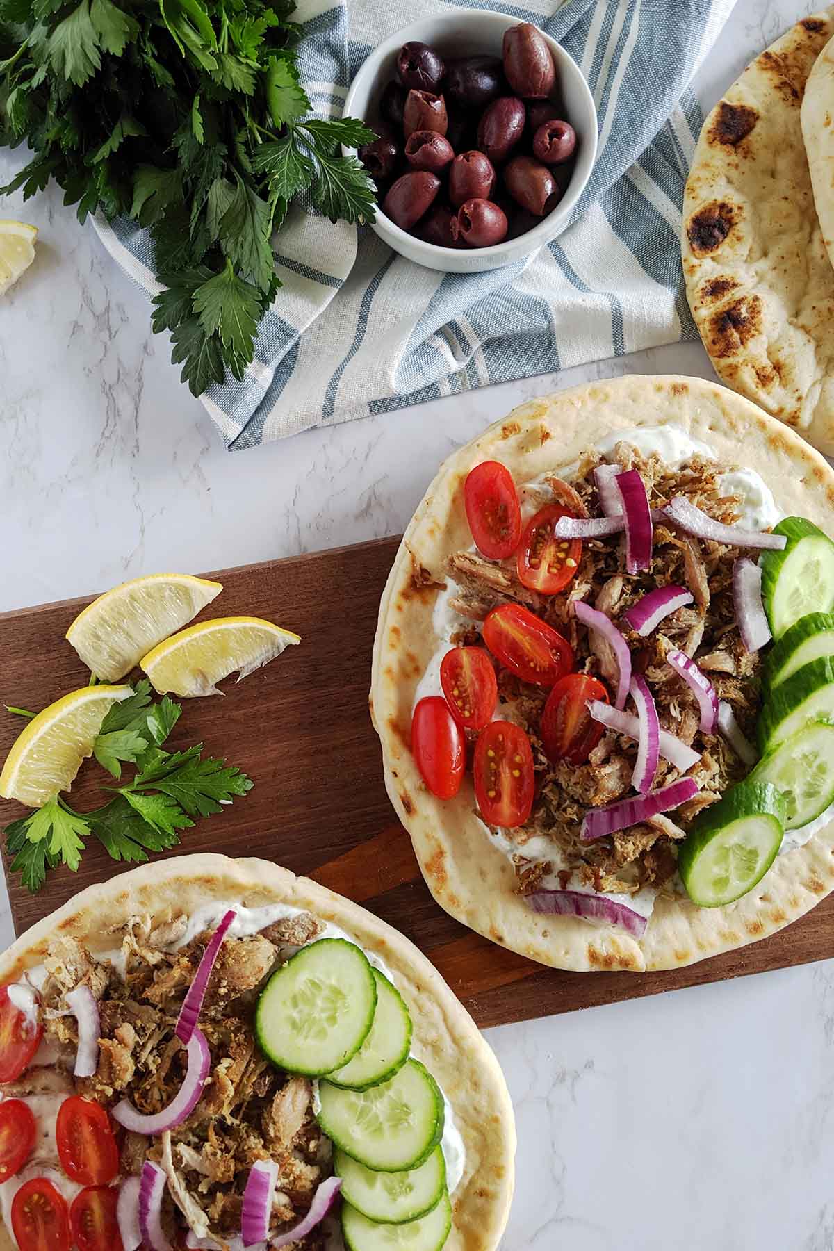 crispy pork gyros with fresh vegetables.