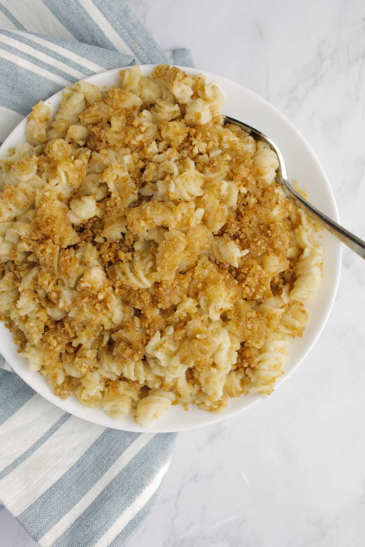 baked mac and cheese with spoon nestled in it.