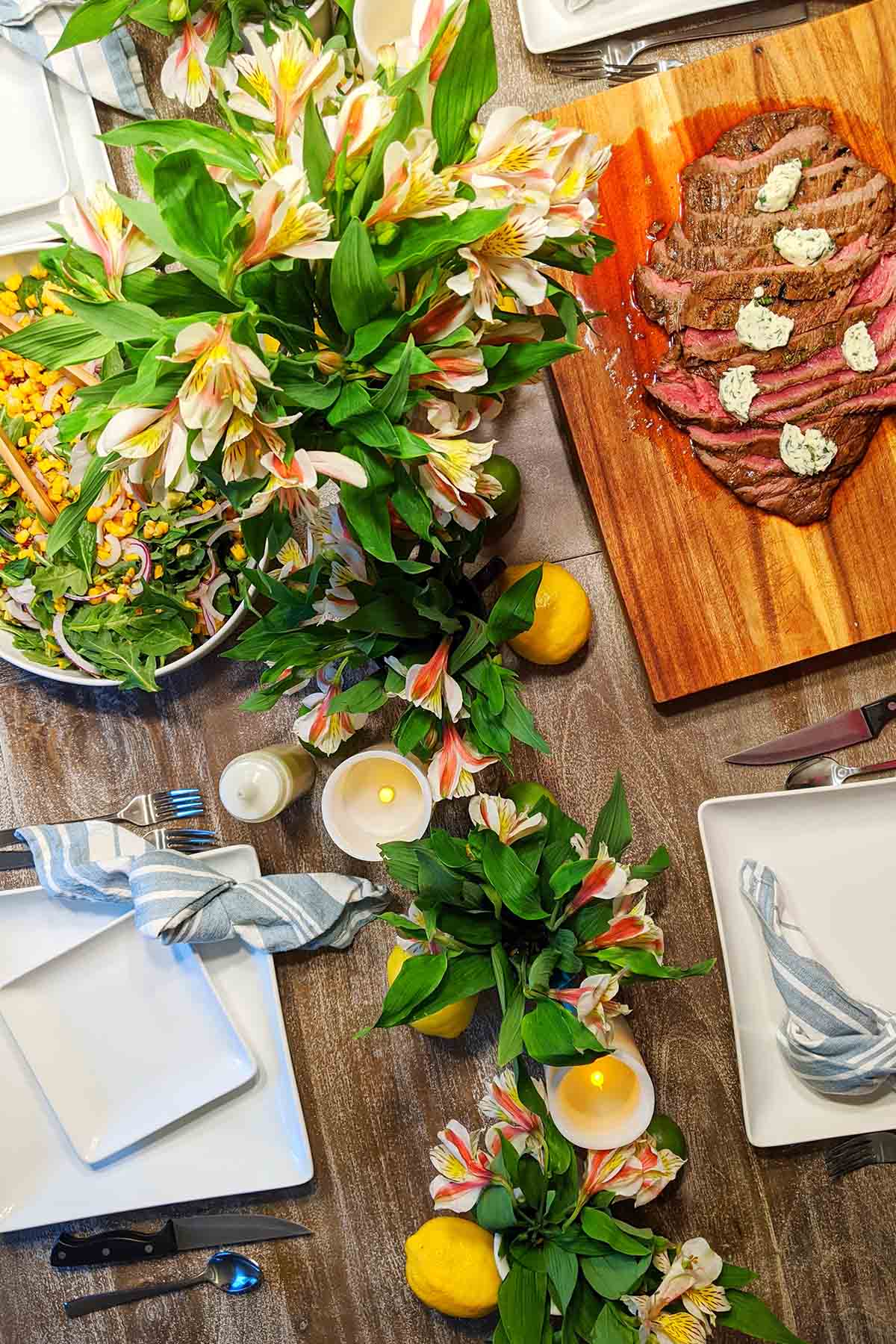 summer dinner party tablescape with salad and steak.