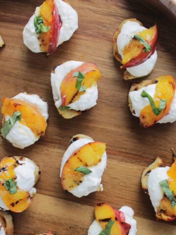 grilled crostini topped with peaches.