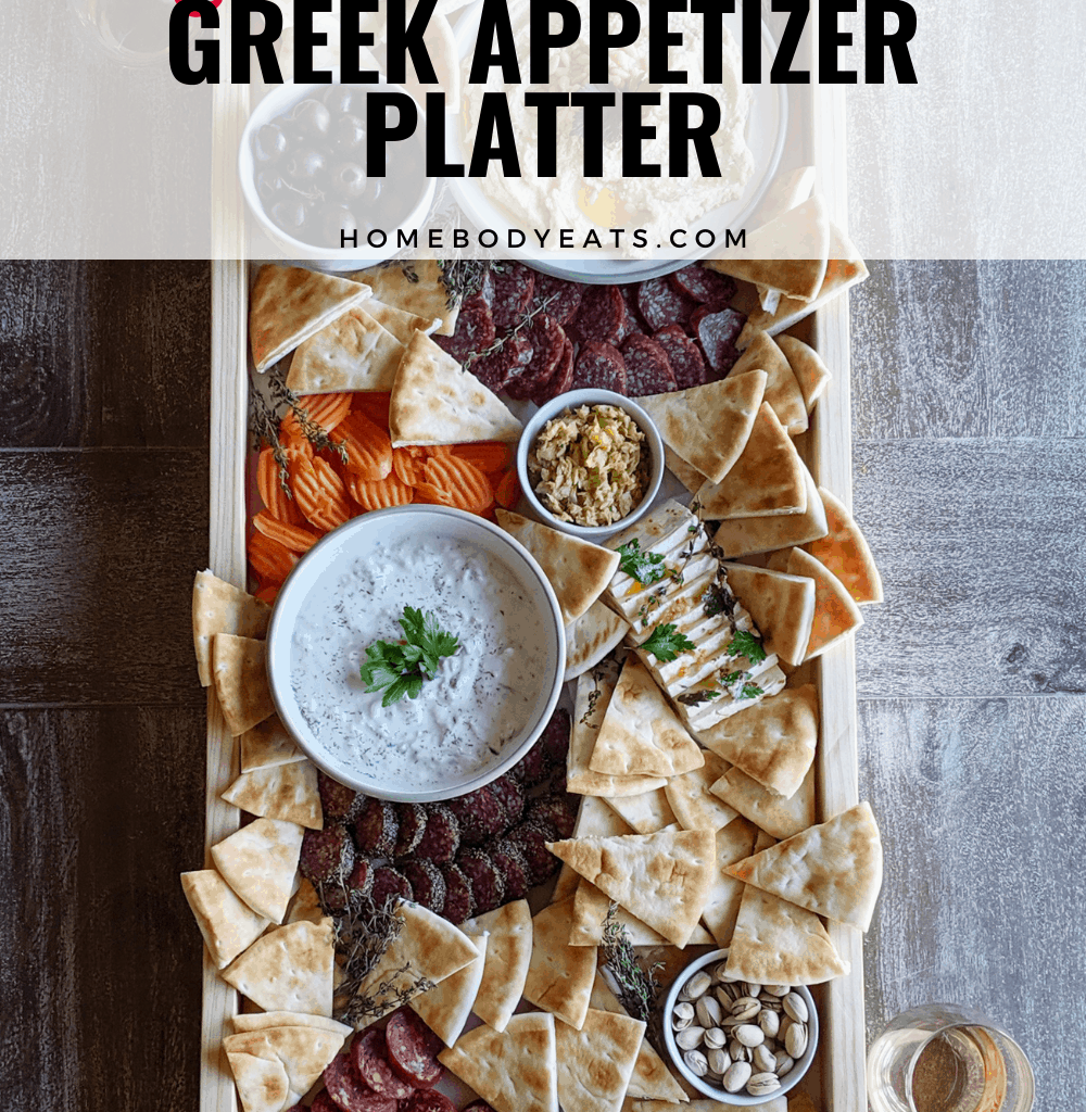 long Greek appetizer platter with various foods.