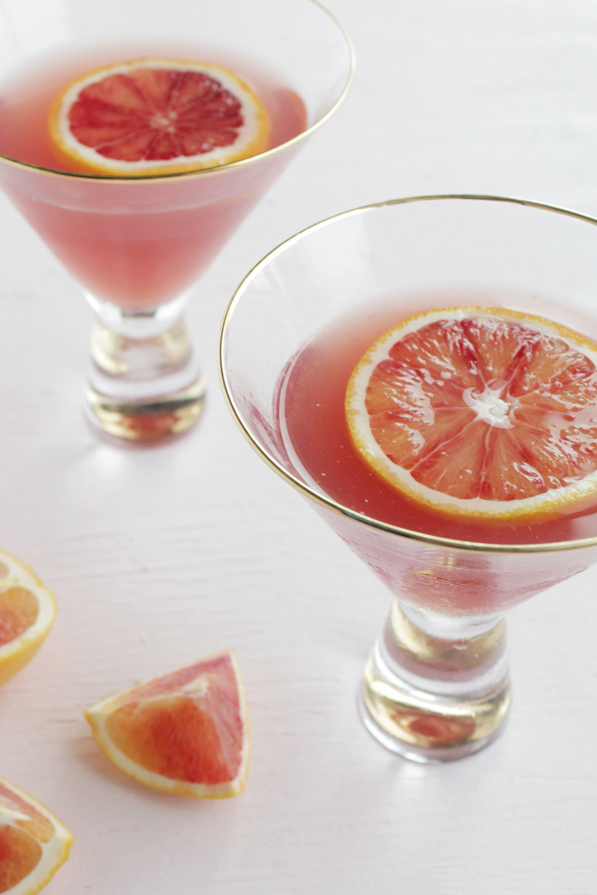 pomegranate and orange dry gin martini cocktail.