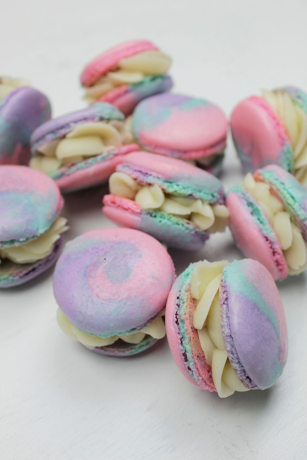 tie dye macaron shells filled with buttercream.
