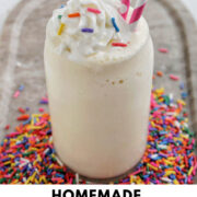 vanilla milkshake with whipped cream and sprinkles with text overlay.