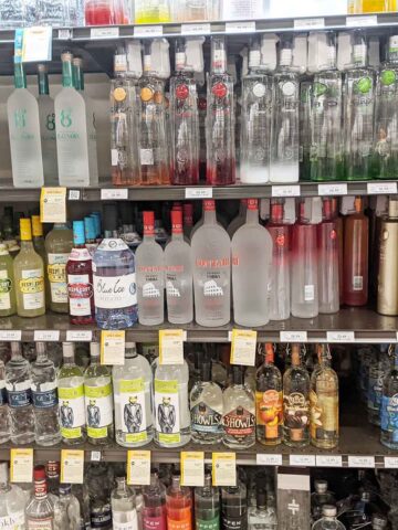 store shelf full of vodka bottles.