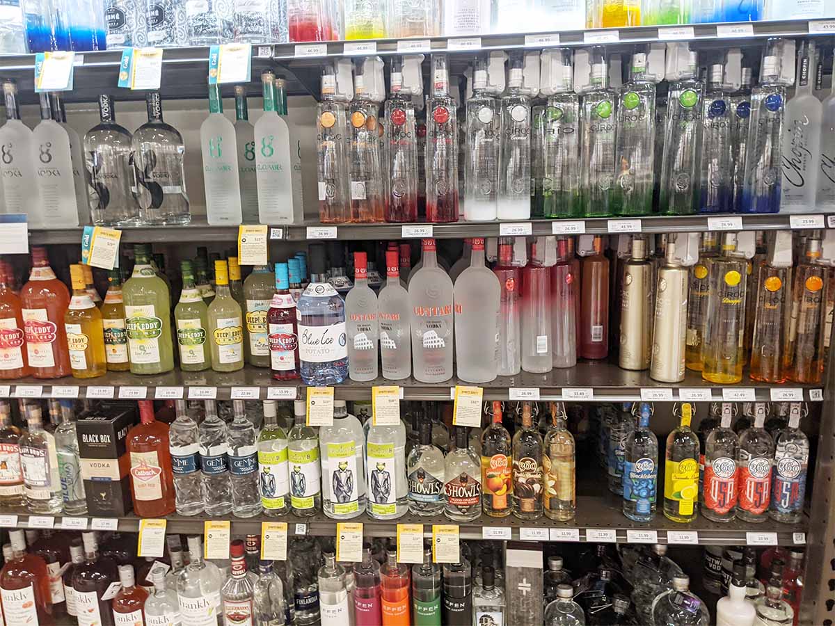  bottles of alcohol on shelves.