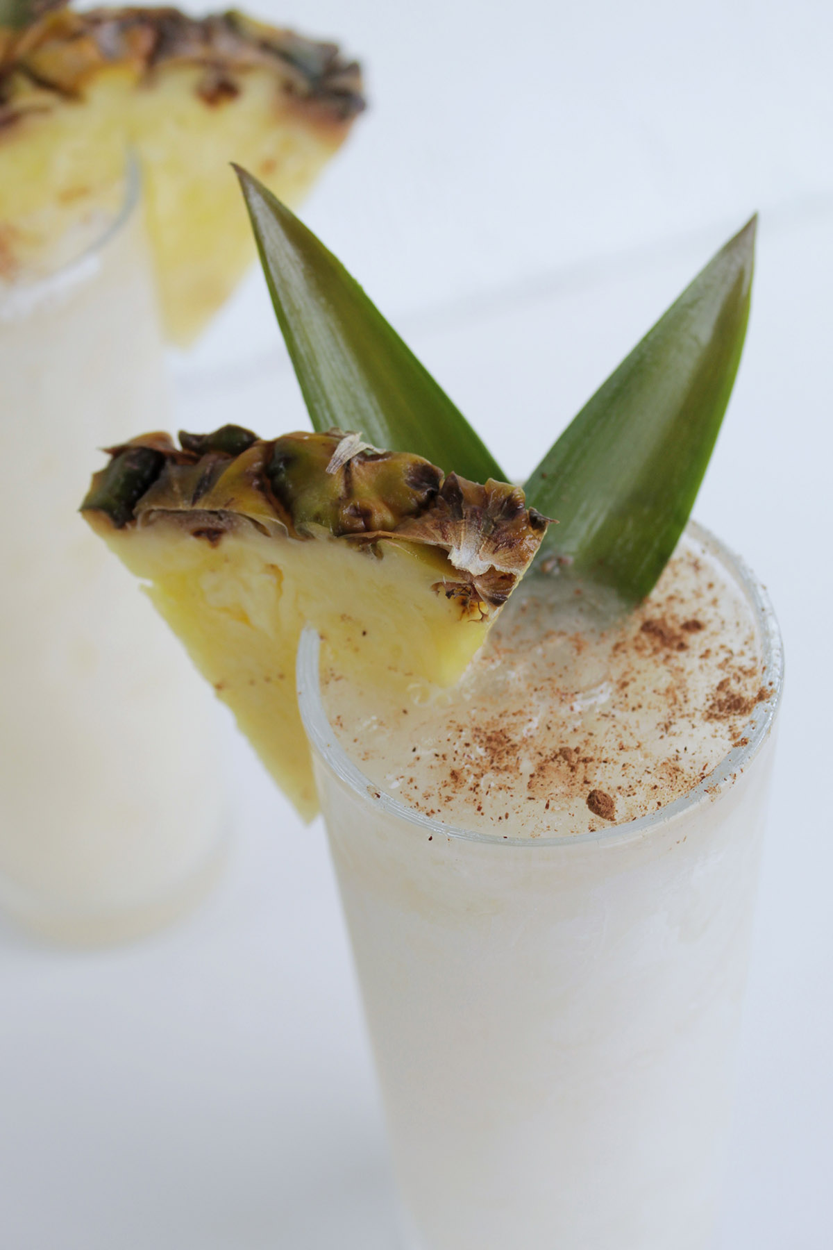 pineapple and cinnamon garnish on tiki cocktail.