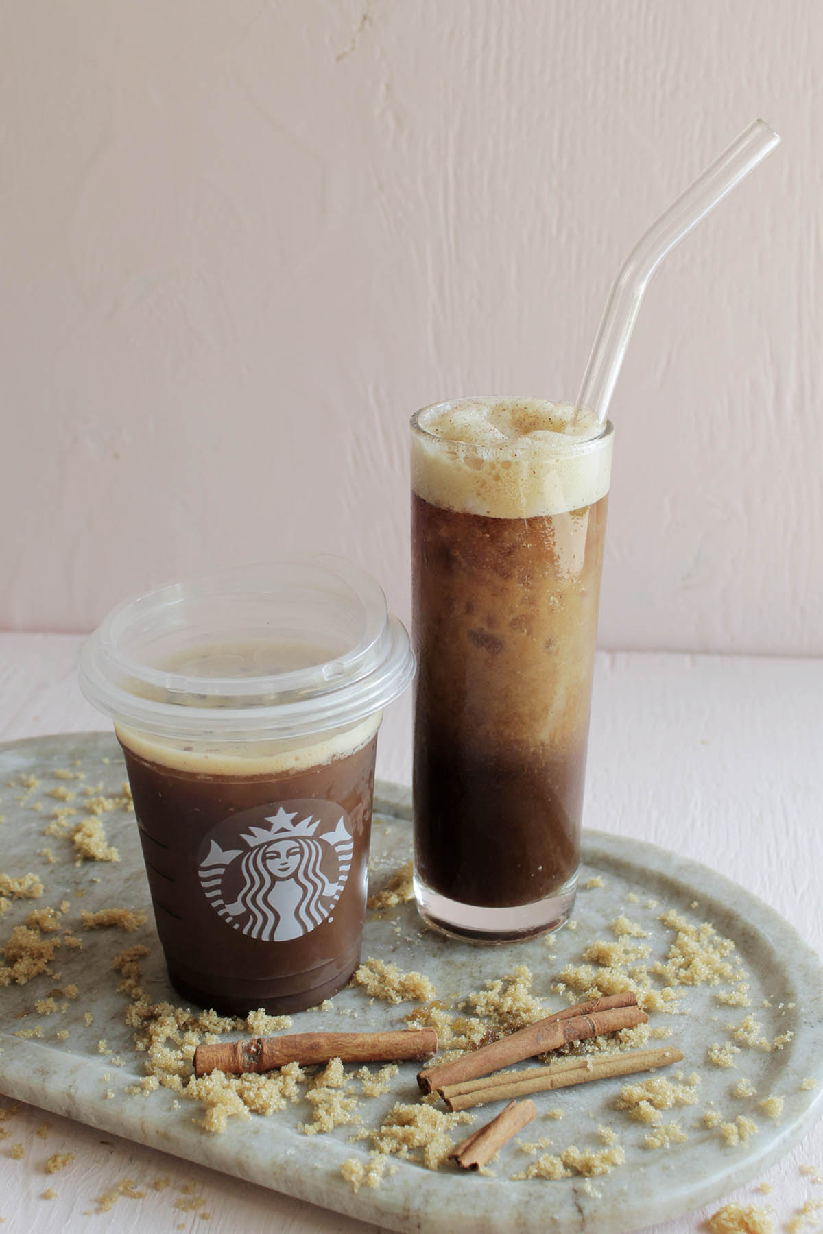 Starbucks oat milk shaken espresso next to homemade version.