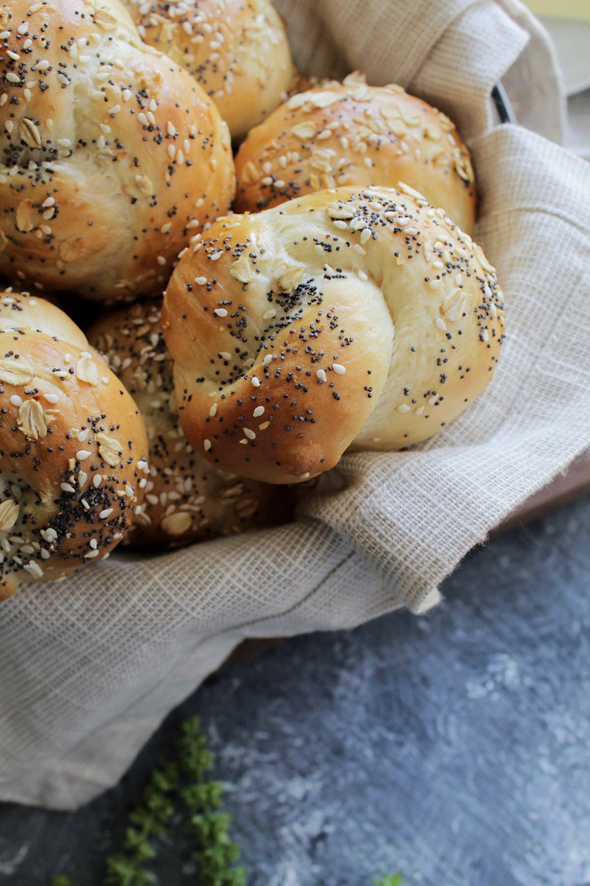 bowl of knotted challah rolls.
