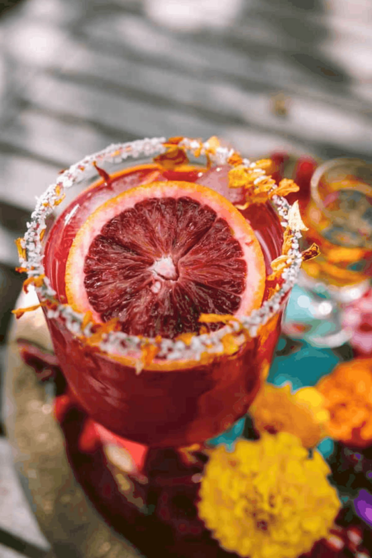 blood orange cocktail with marigold flowers