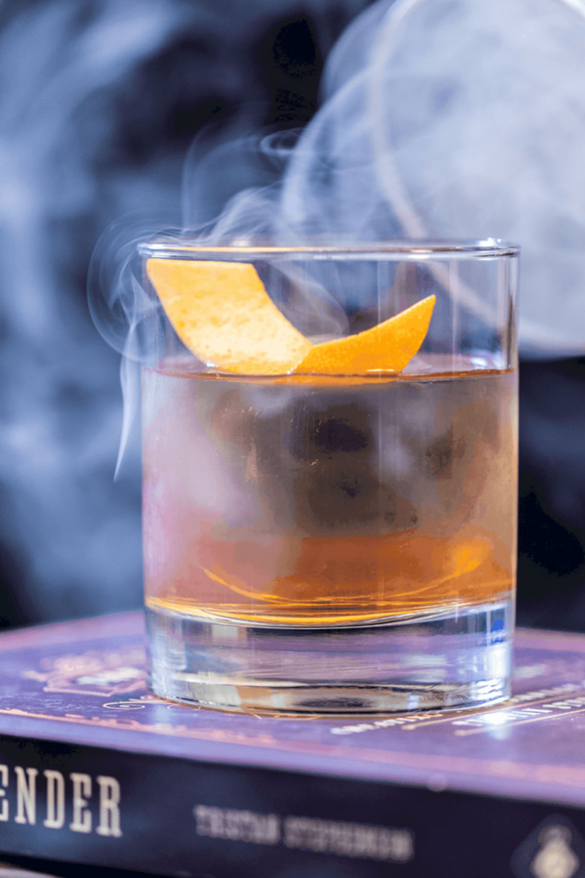 smoking cocktail with orange peel