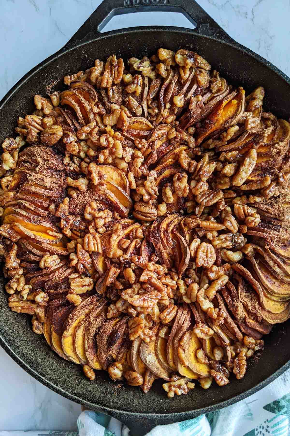 sliced sweet potato casserole in skillet