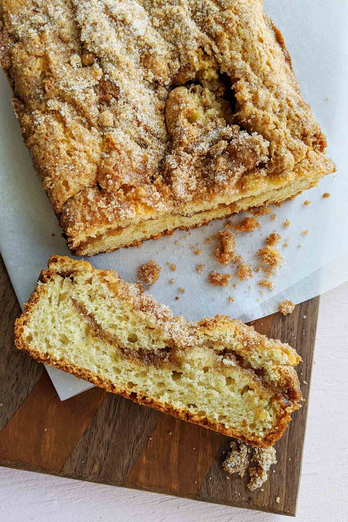 coffee cake loaf with one slice cut off.