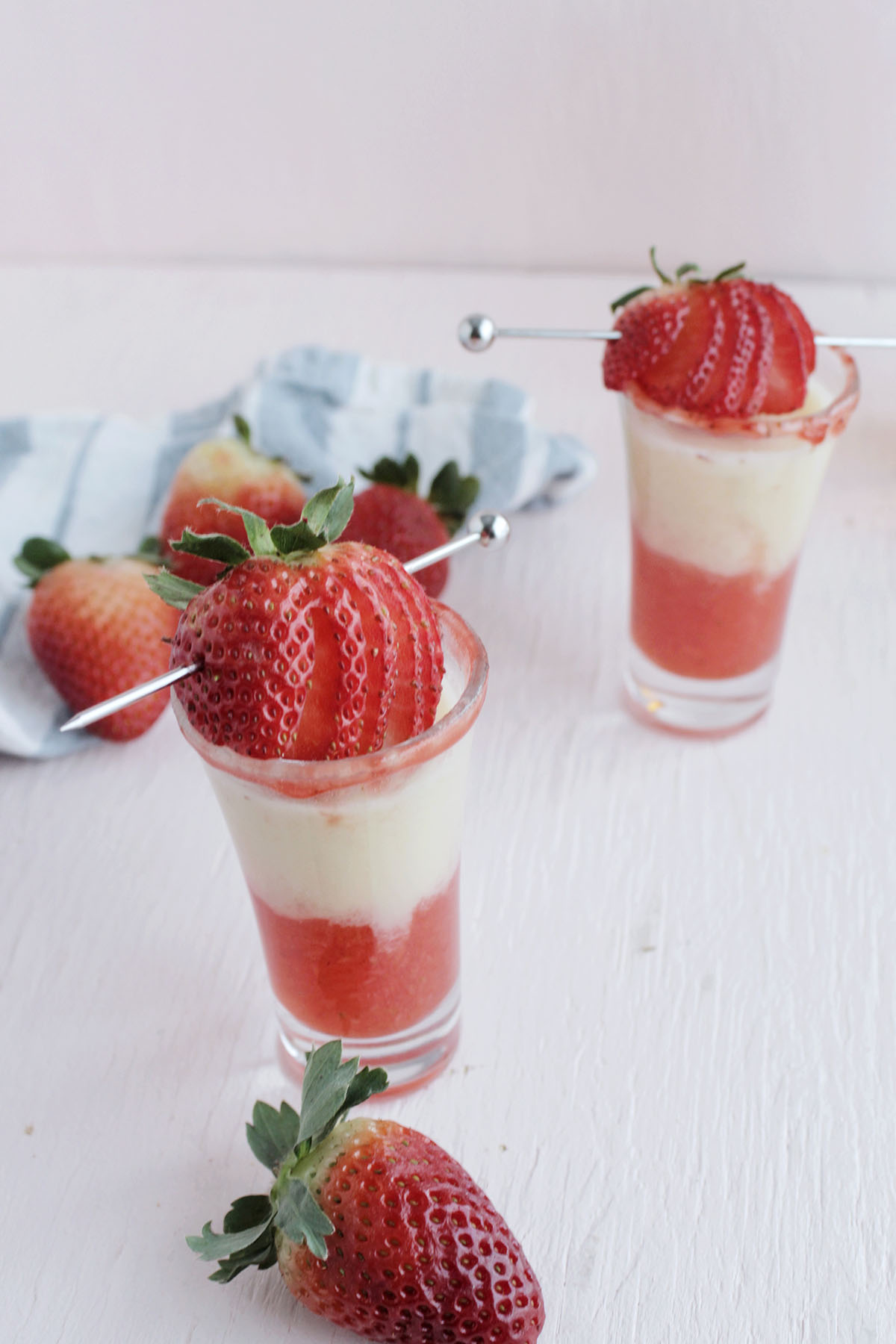 peanut butter and jelly shot garnishes with strawberry