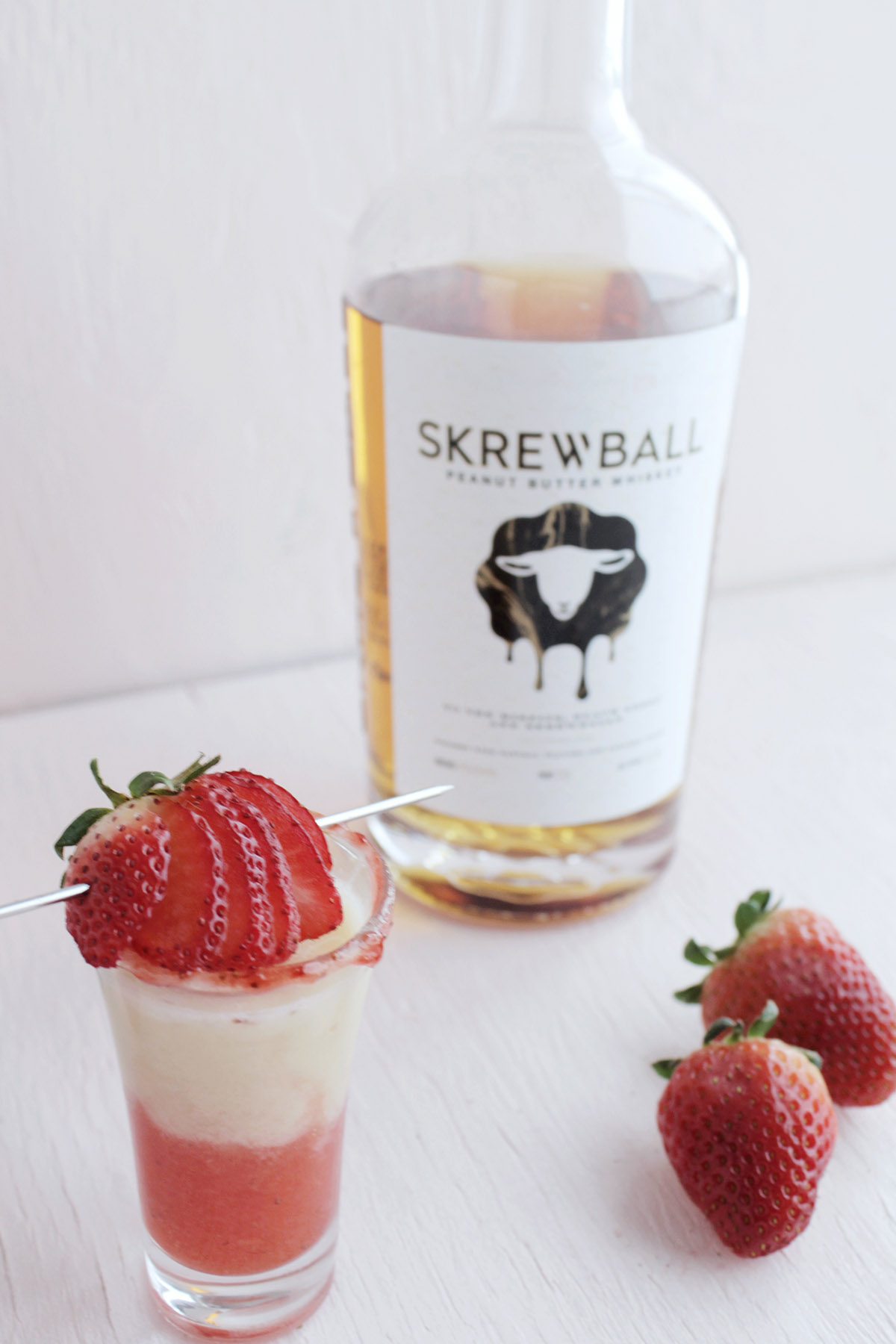 layered shot with strawberry and peanut butter whiskey.