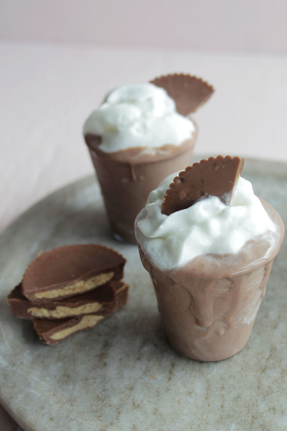 peanut butter whiskey pudding shots with Reese's garnish.