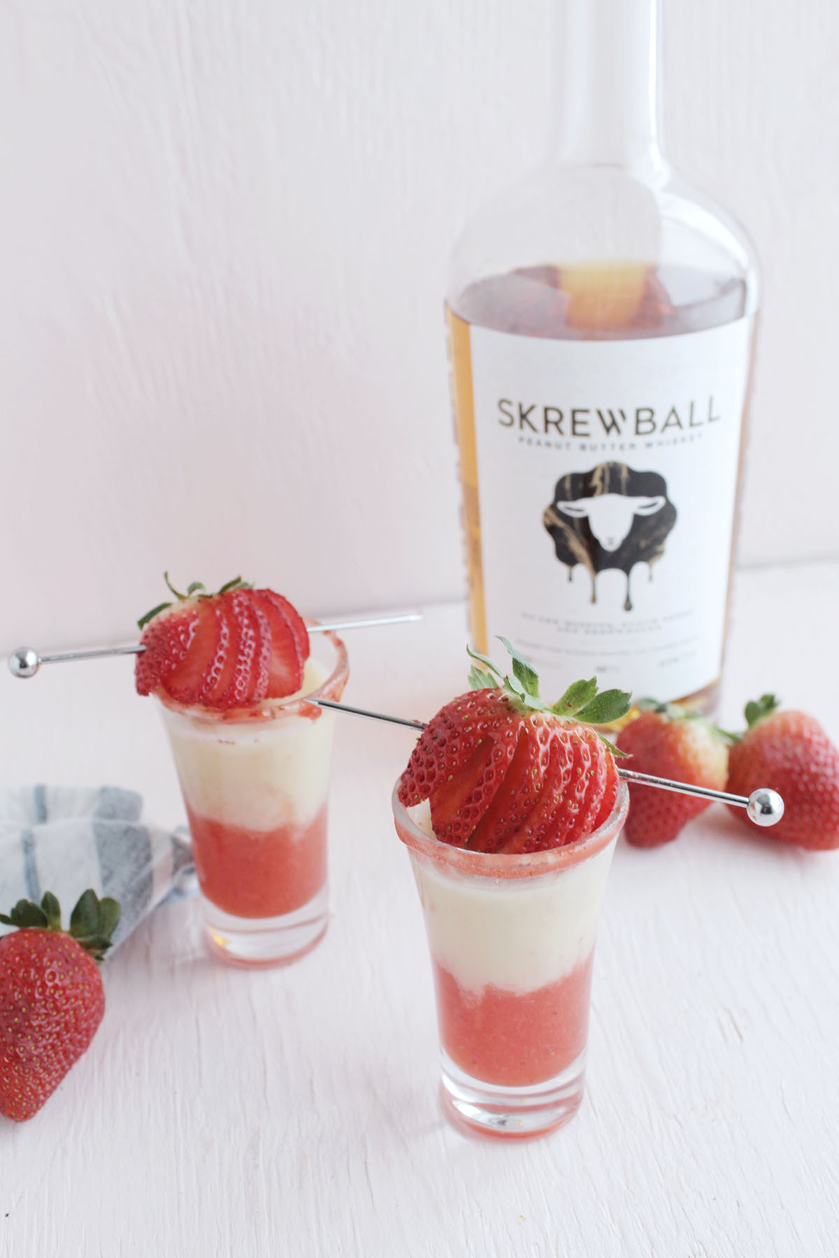 skrewball peanut butter whiskey shot with strawberry