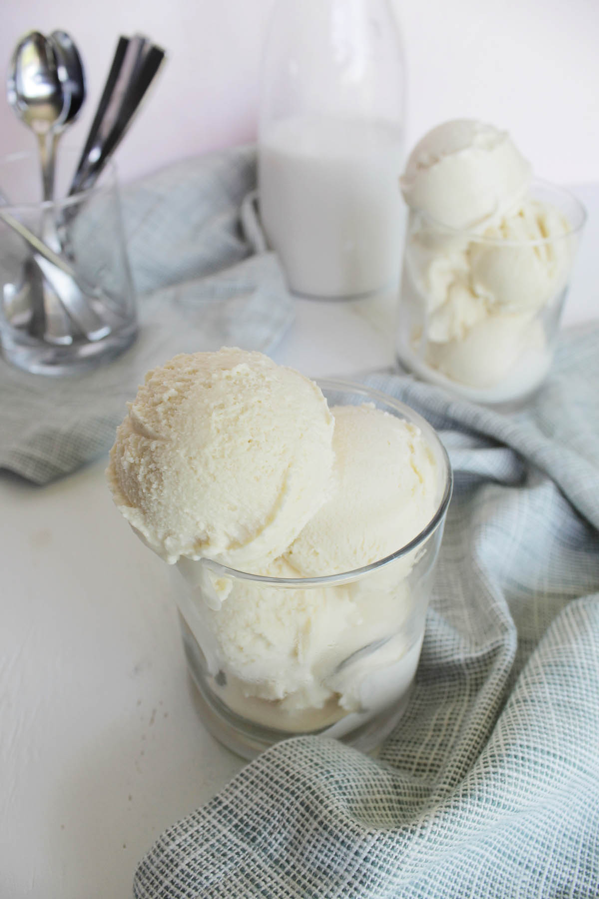 classic vanilla ice cream scoops in glass cup.