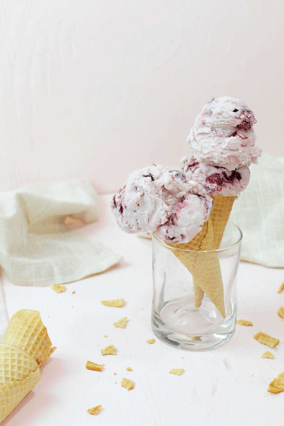 dark cherry ice cream in waffle cones.