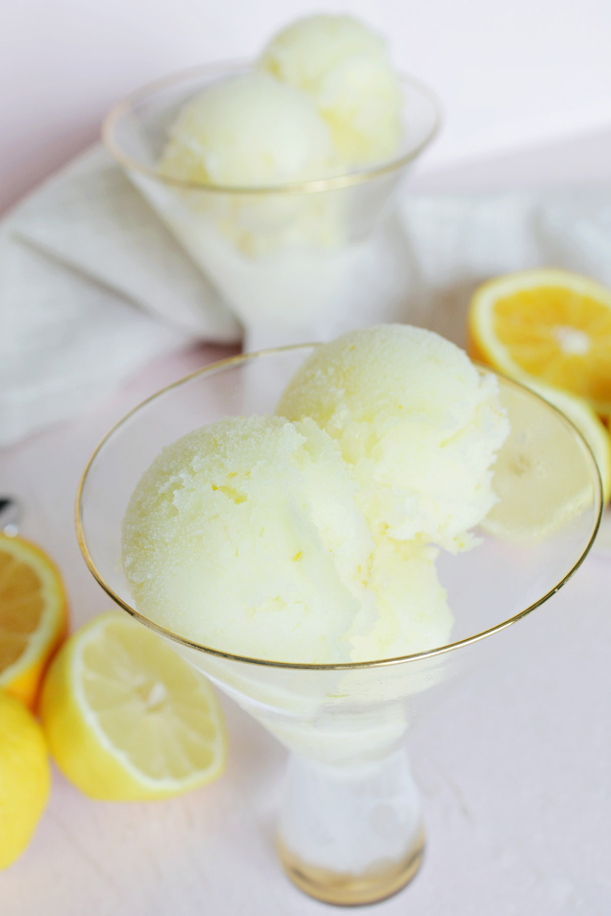 yellow limoncello sorbet in martini dessert glass.