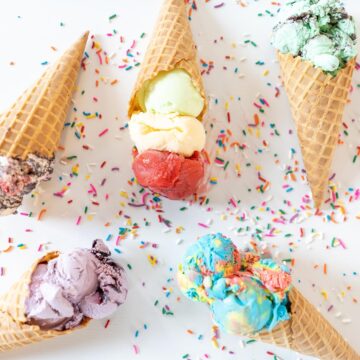 various flavors of ice cream in waffle cones.