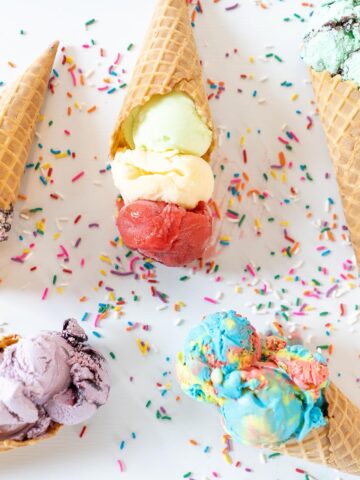various flavors of ice cream in waffle cones.