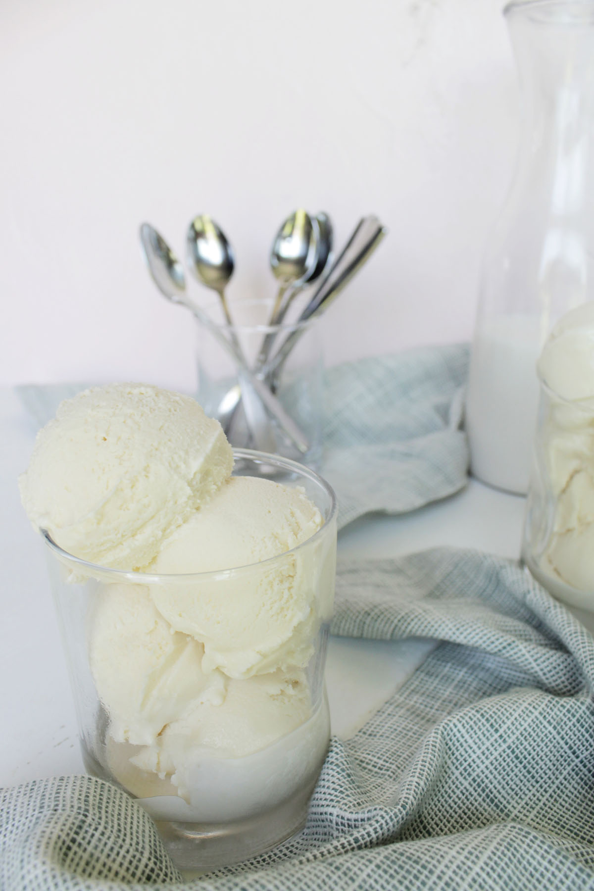 vanilla ice cream scoops in a glass cup.