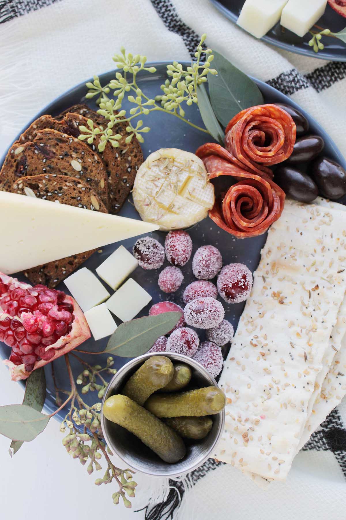 single serve cheese board on blue plate.