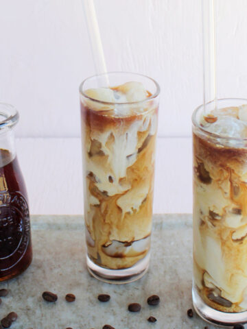 two glasses filled with salted caramel cold brew.