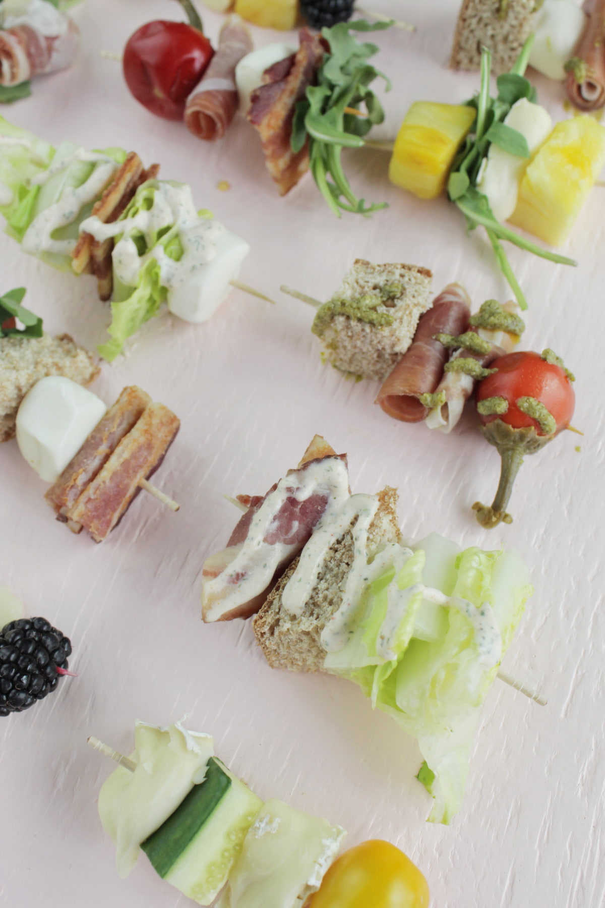 appetizer skewers with dressing.