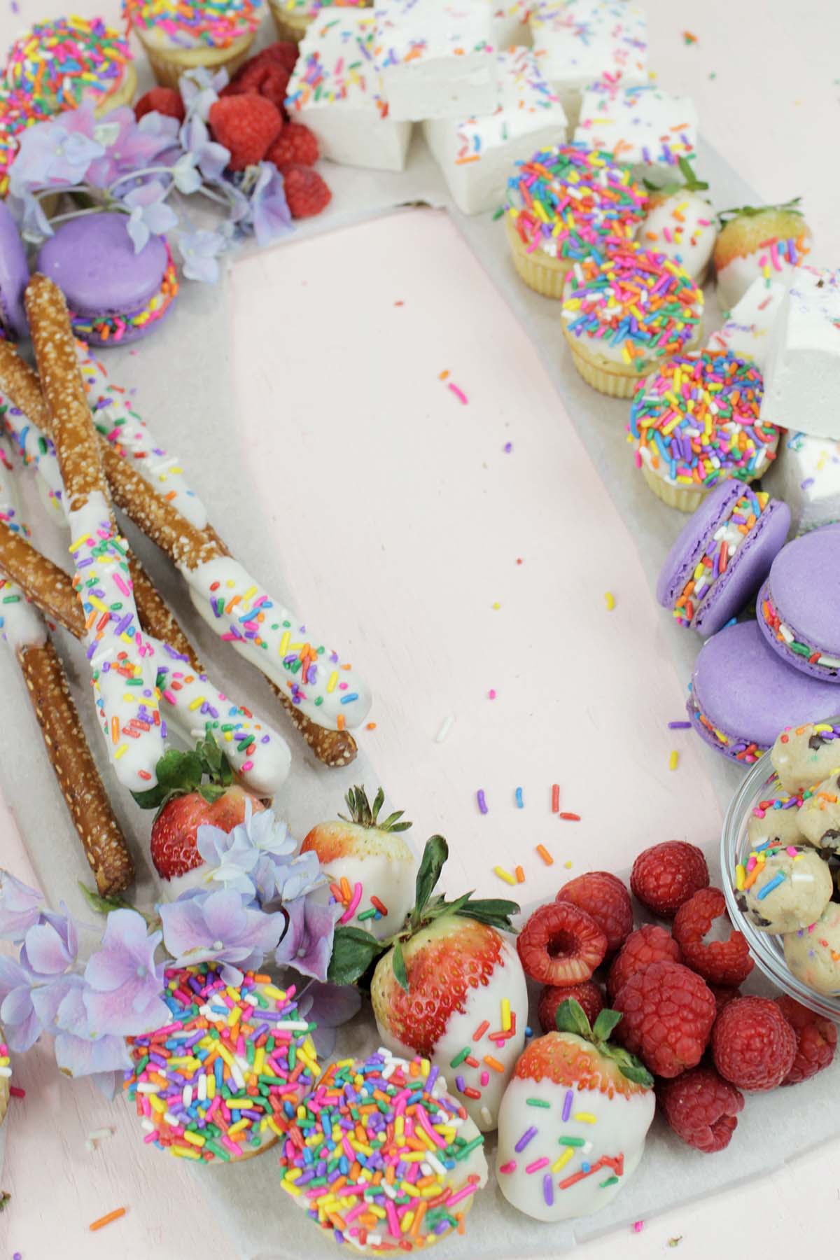 colorful birthday dessert charcuterie board with sprinkles.
