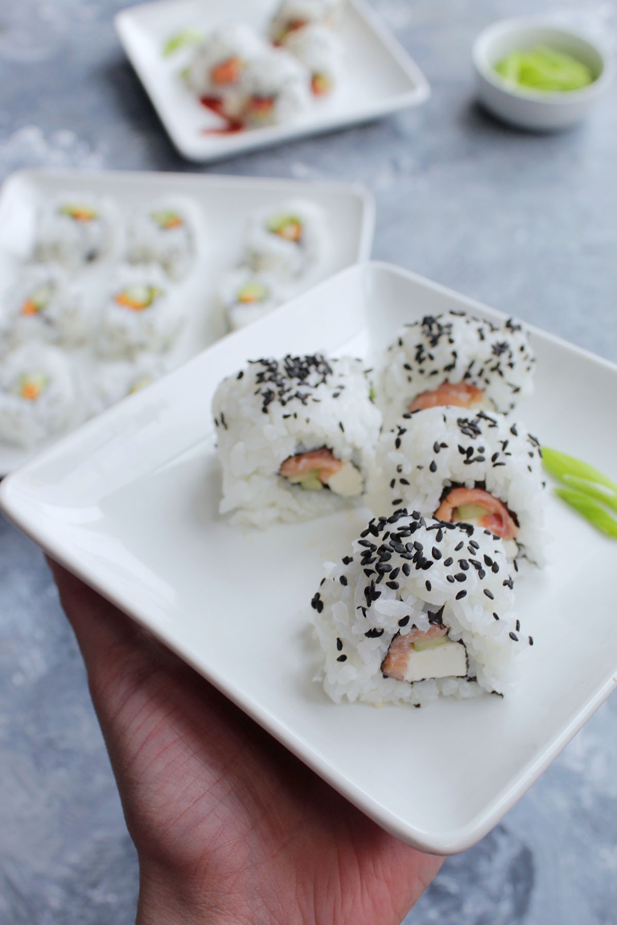 cream cheese sushi rolls on white plate.