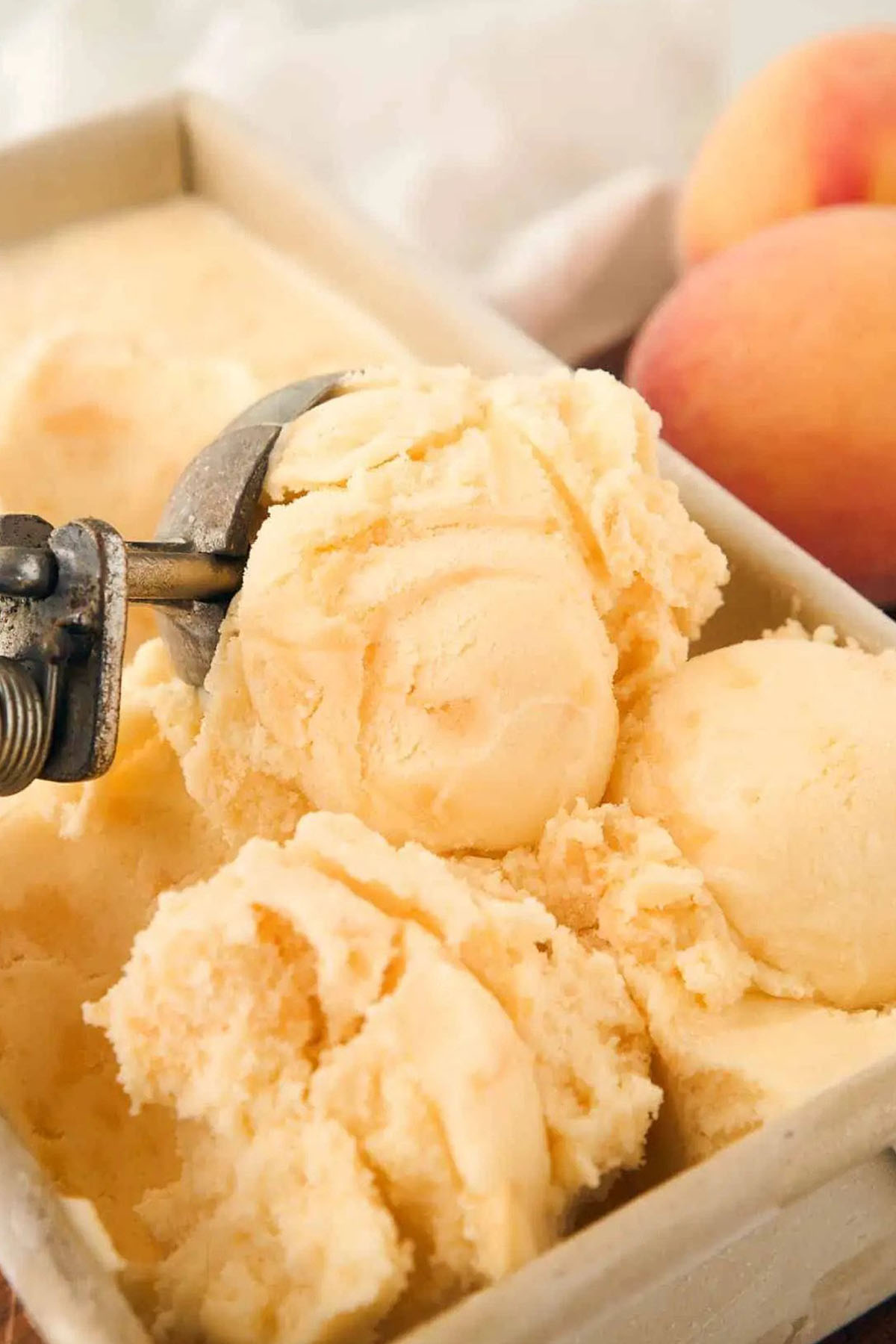 scooping peach flavored ice cream.