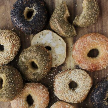 golden brown bagels with various toppings.