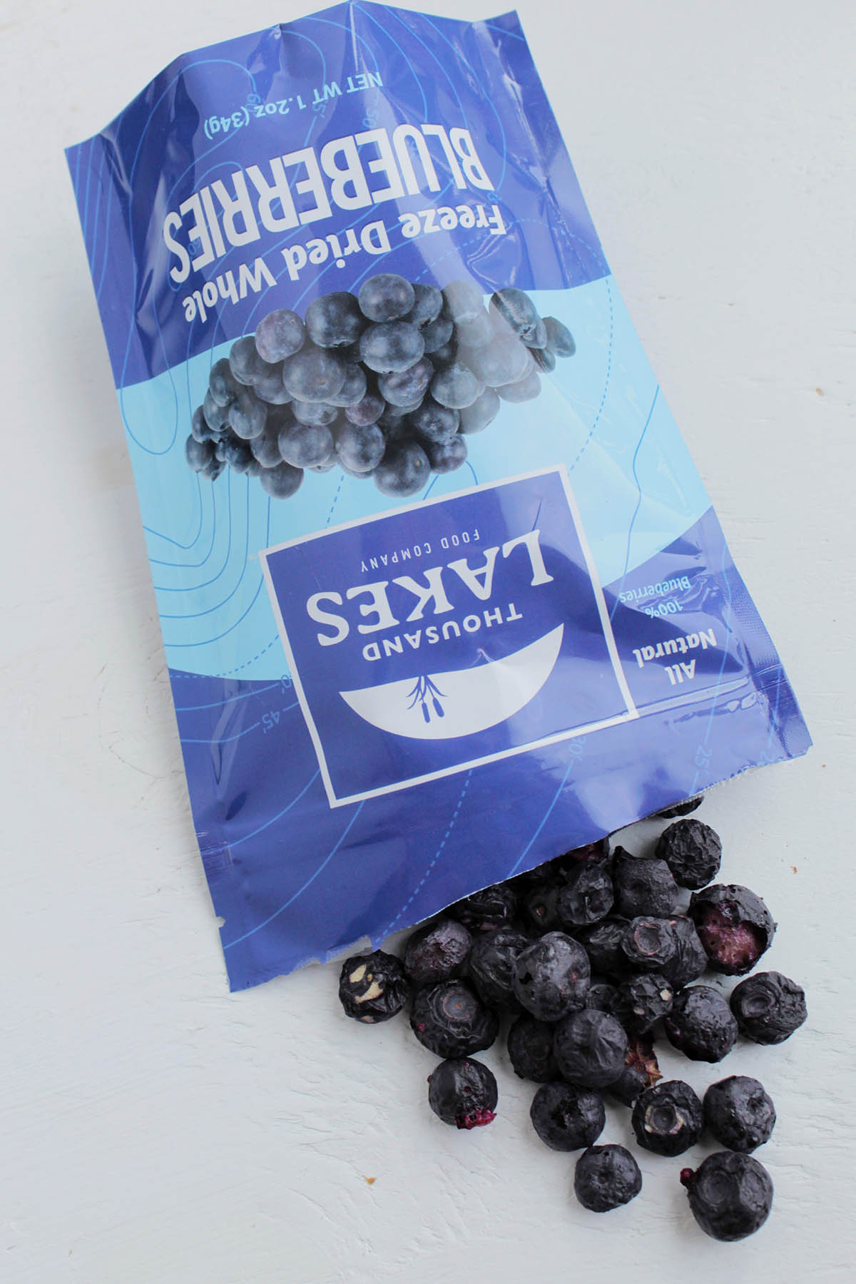 freeze dried blueberries pouring out of a bag.