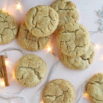 multiple snickerdoodle cookies laying on top of twinkle lights.