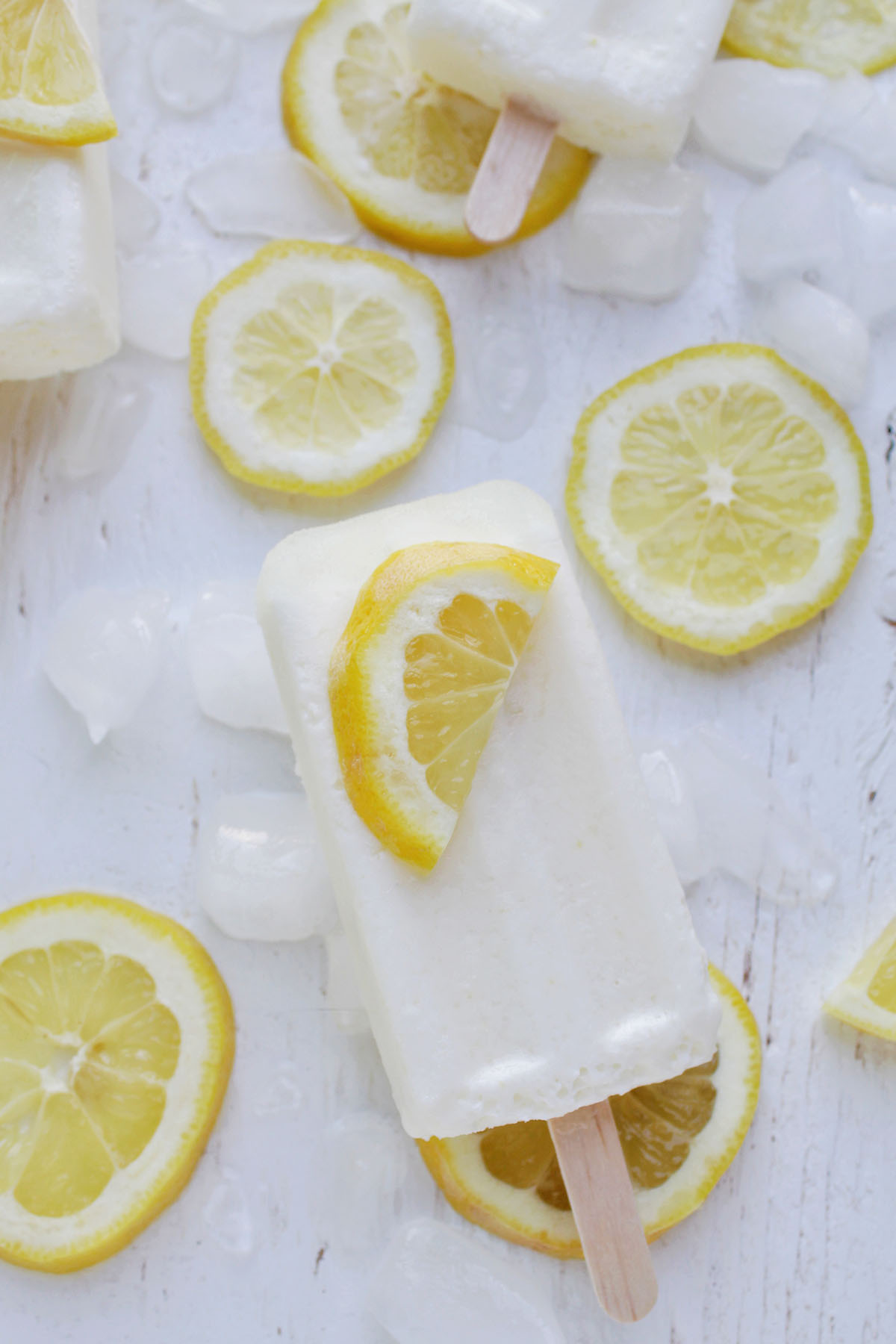 lemon popsicle topped with a half a lemon slice.