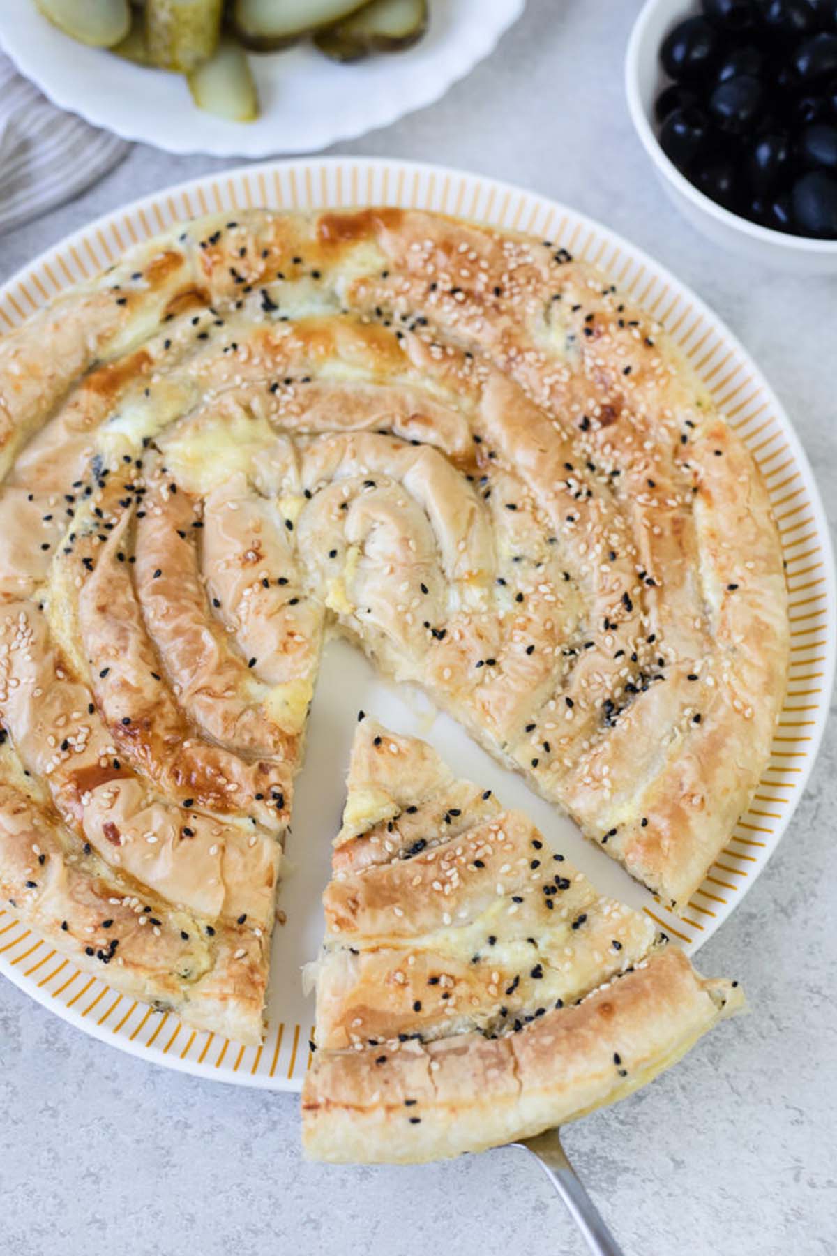 phyllo dough pie topped with sesame seeds.