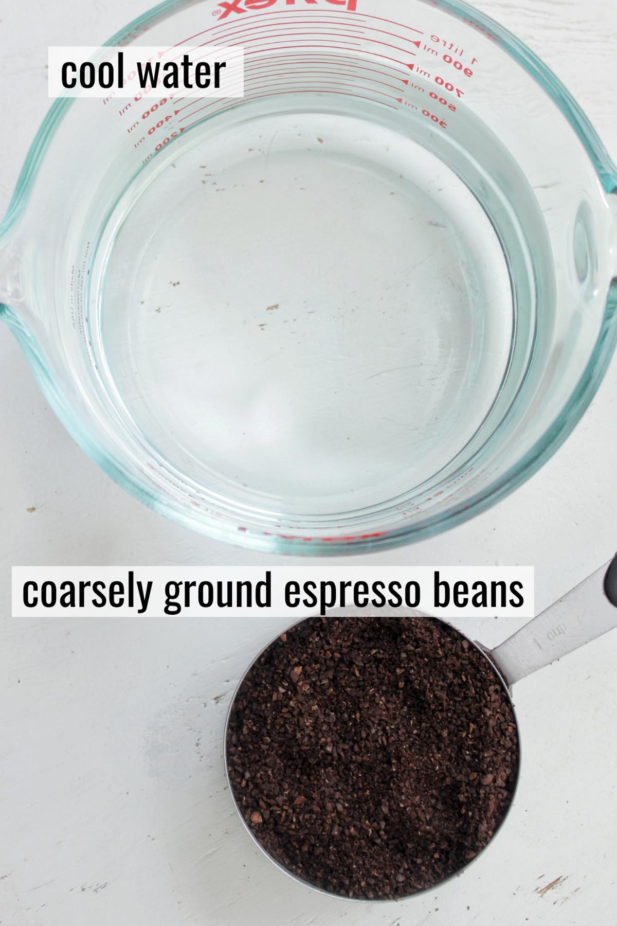 water and ground coffee beans in measuring cups.