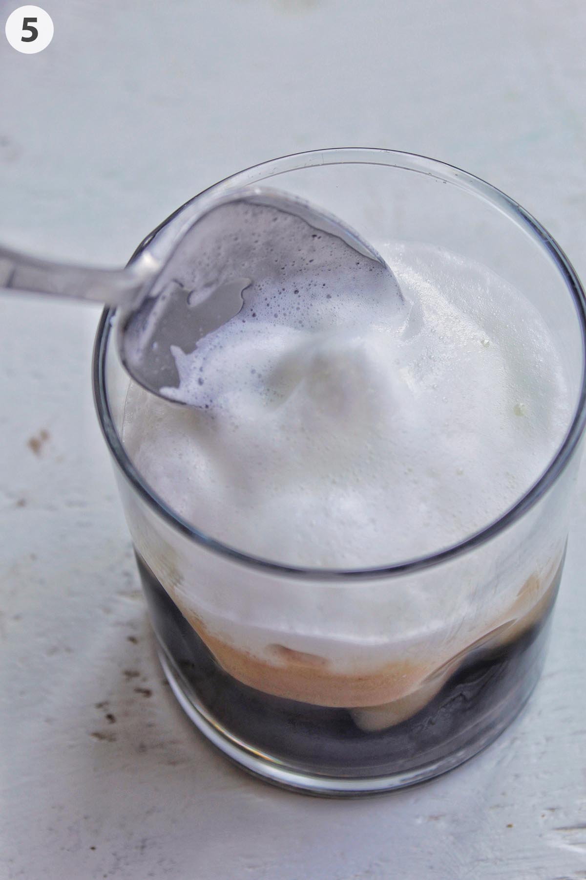 adding cold foam on the top of espresso.