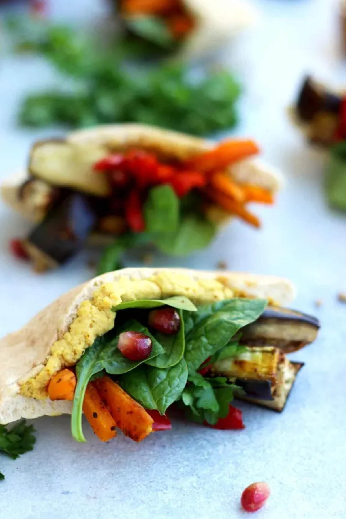 hummus pita pockets stuffed with vegetables.