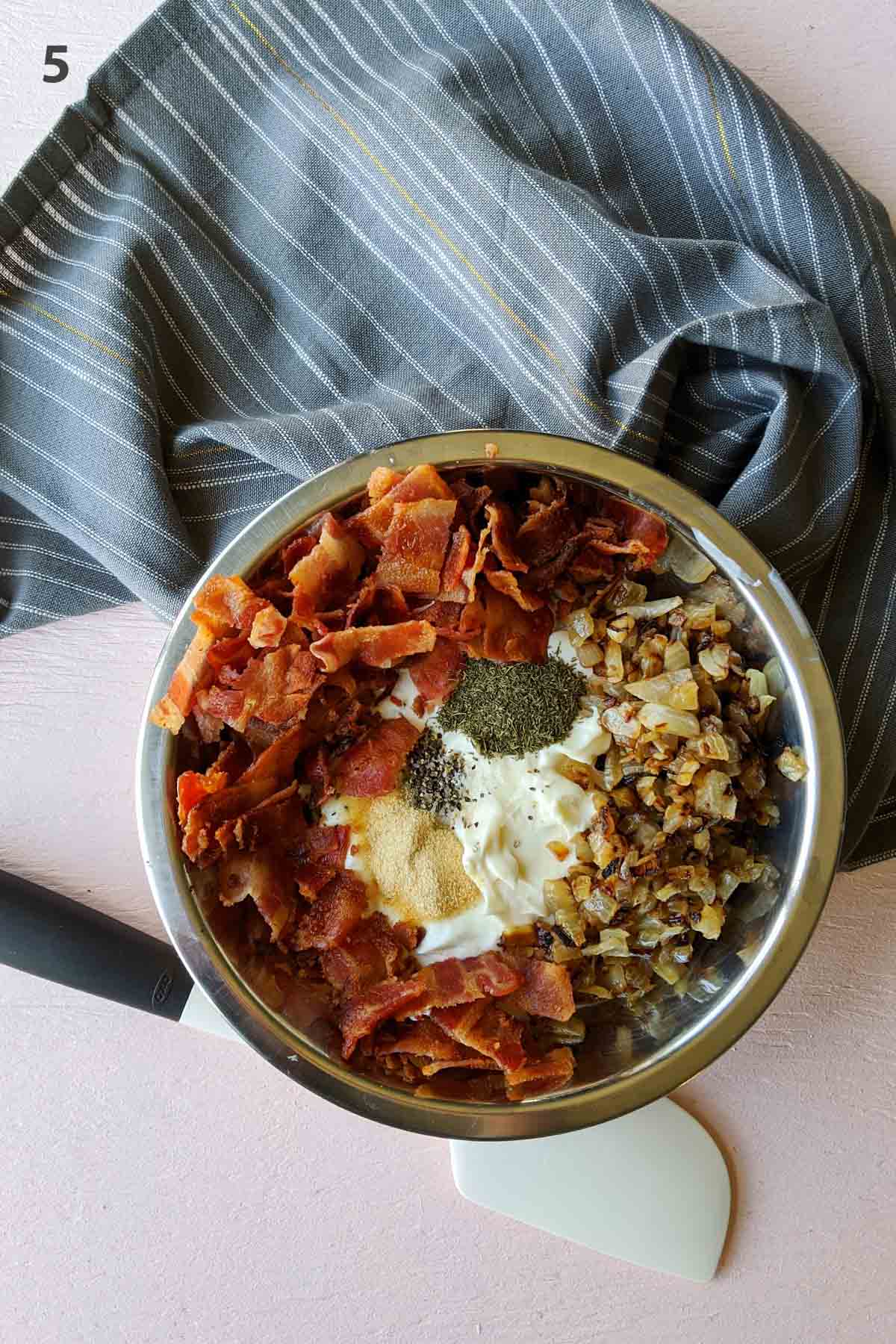 mixing bowl filled with dip ingredients.