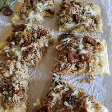 pizza slices topped with dried figs and shredded pork.
