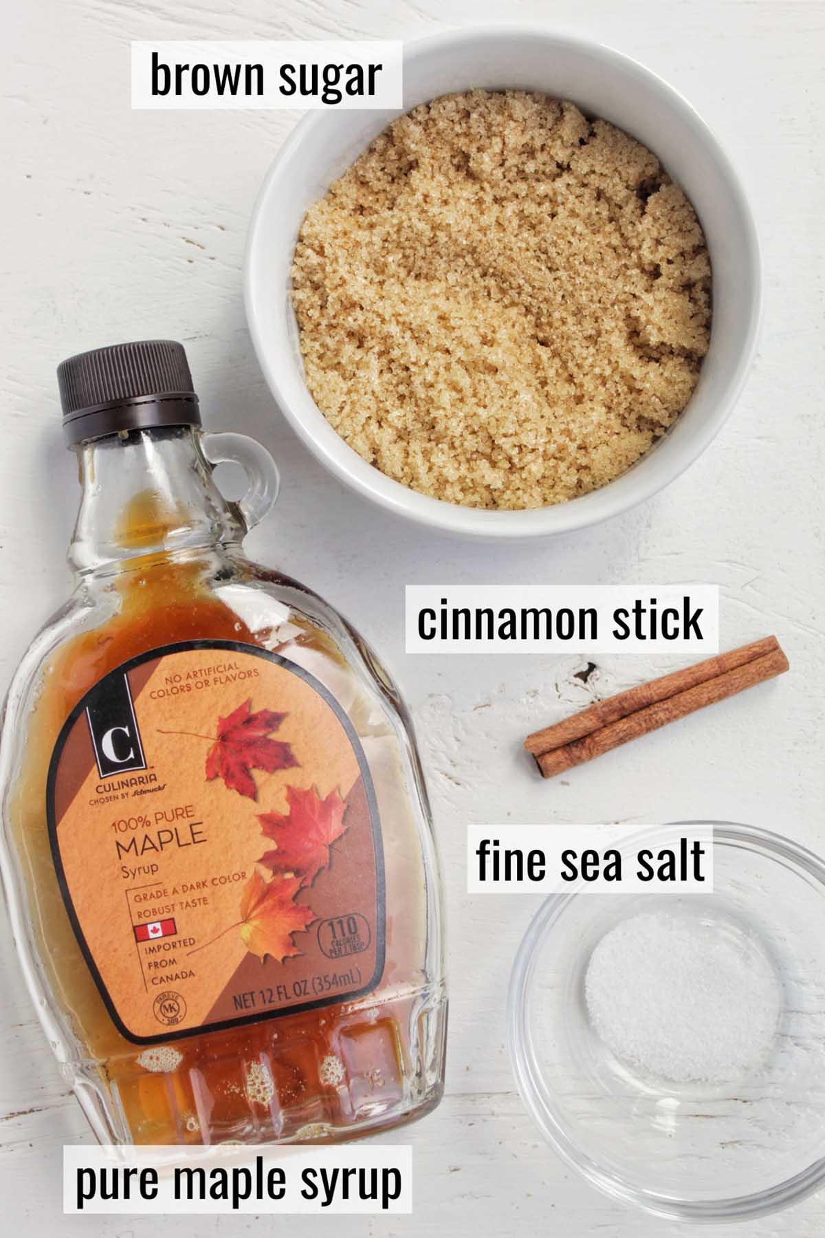 maple syrup, brown sugar, cinnamon stick, and fine sea salt with labels.