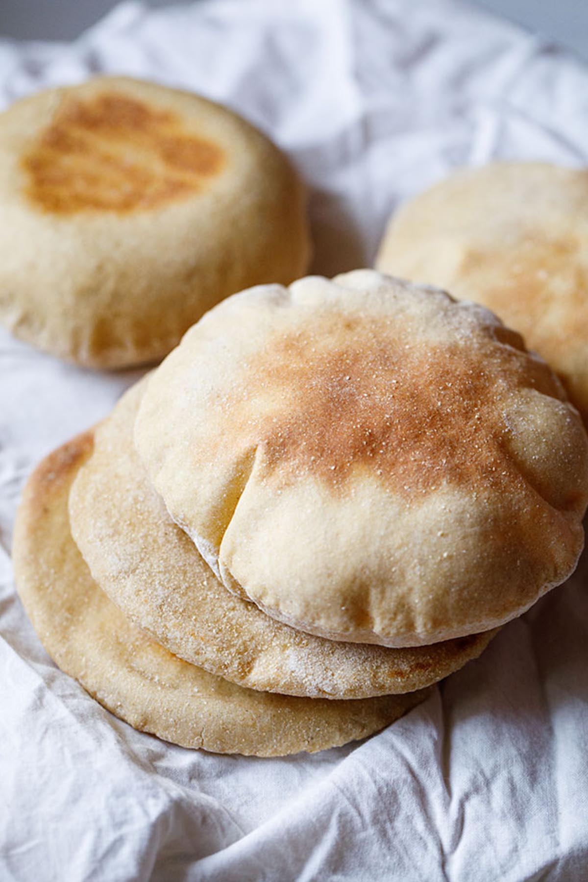 pita bread stacked on top of each other.